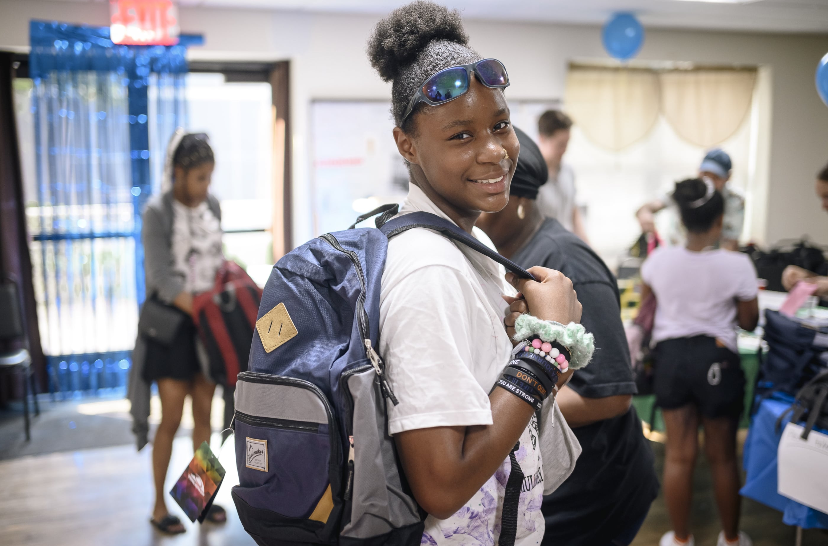 Belveron Donates and Distributes Backpacks and School Supplies in Harlem